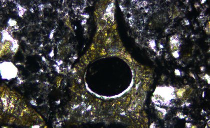 Tiny volcanic fragment from meteorite site in Canada Tiny volcanic fragment from meteorite site in Canada